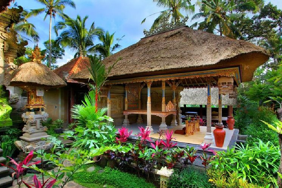 wooden house in bali in the middle of garden