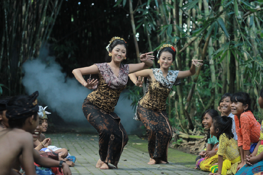 two woman dancing traditional dance bali