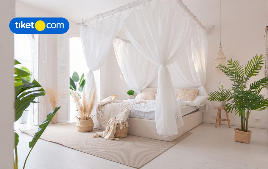 bed with curtains white at hotel