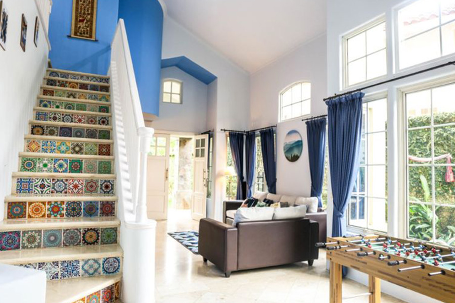 living room with stairs all white