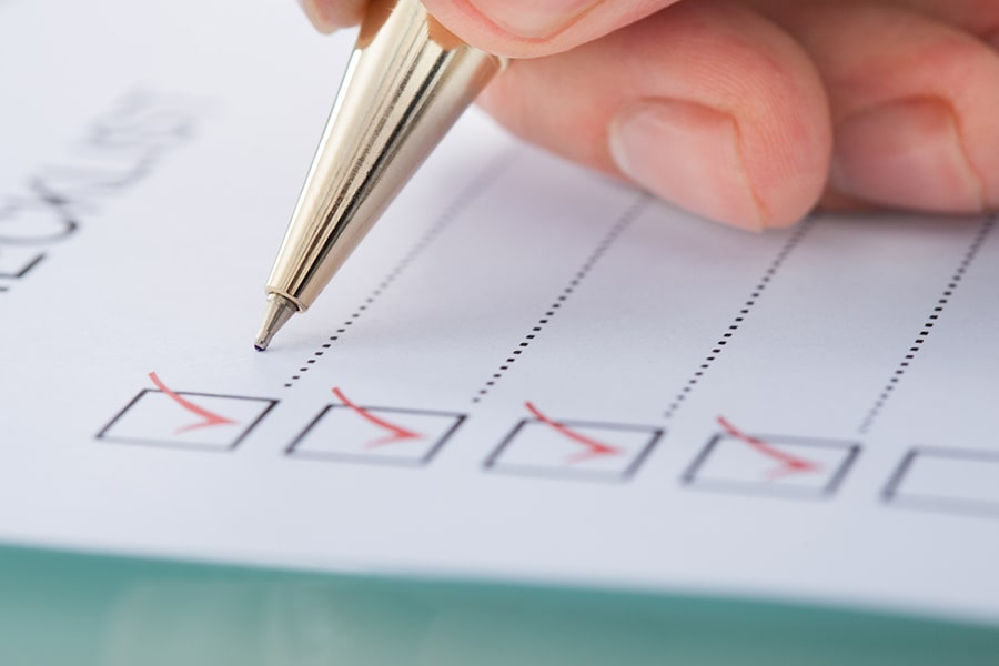 pen on paper making checklist